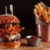 Boucher Burger · Cheddar, tobacco spiced onion rings, black pepper bacon, pickled jalapeños, BBQ sauce, and s...