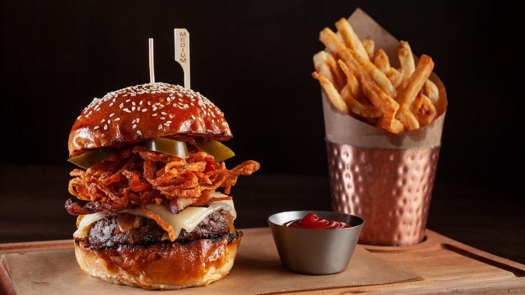 Boucher Burger · Cheddar, tobacco spiced onion rings, black pepper bacon, pickled jalapeños, BBQ sauce, and served with fries.