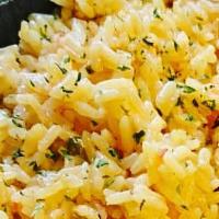 Garlic Yellow Rice · Yellow Rice infused with our homemade garlic butter