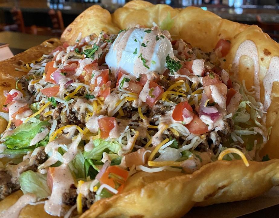 Taco Salad · Crispy tortilla bowl stuffed with shredded lettuce, pico de gallo, sour cream, and cheddar jack cheese.  Your choice of taco meat or grilled chicken and served with southwest ranch.