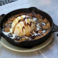 Lloyd'S Cookie Skillet · Warm chocolate chip cookie with vanilla ice cream. Topped with caramel & chocolate sauce