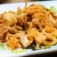 Fried Calamari · Golden fried calamari served with tomato sauce