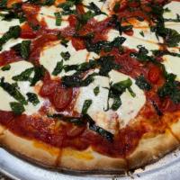Mars · Margherita pizza. Pizza sauce, fresh mozzarella, fresh basil, olive oil, cherry tomatoes.