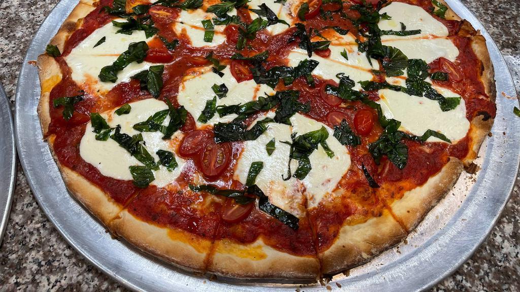 Mars · Margherita pizza. Pizza sauce, fresh mozzarella, fresh basil, olive oil, cherry tomatoes.