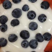 Yogurt Parfait · Vanilla or strawberry yogurt mixed in with blueberries, strawberries, and granola.