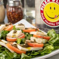 Caprese Salad · Nut allergy. fresh tomato, fresh mozzarella, basil & balsamic vinaigrette. lettuce, topped w...