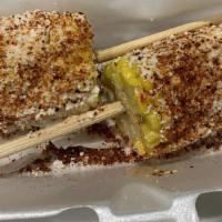 Elote · Corn on the cob, mayo, cotija cheese, chili powder (tajin).