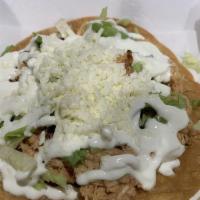 Tostada · Your favorite protein in a toasted fried corn tortilla, topped with beans, lettuce, cheese a...