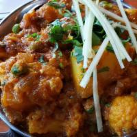Aloo Gobi · Gluten-Free, Vegan. Potatoes and cauliflower mixed with Indian herbs and spices.