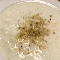 Kheer (Rice Pudding) · Saffron flavored basmati rice pudding.