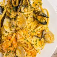 Seafood Pasta · Comes with clams, black mussels and shrimp (no head) in our garlic butter, no spice sauce.