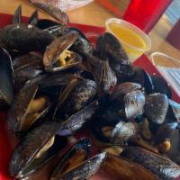 Mussels · Sautéed in lemon, butter, garlic, and wine, served with fresh bread.