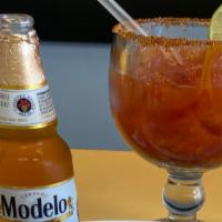Michelada · Elections of beers with Clamato, lime, salt, Valentina and ours secret of tortas gigantes.