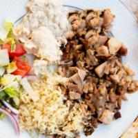 Chicken Shawarma · Chicken marinated with special blend of spices. Served with lettuce, onions, tomato, pickles...