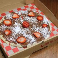 Nutella Pizza · Strawberry Nutella Pizza - a delicious pizza crust topped with strawberries, and Nutella..