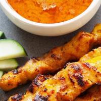 Chicken Satay (4) · Grilled marinated chicken breast on skewers. Served with a peanut sauce.