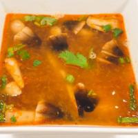 Tom-Yum Soup · Thai classic spicy lemon grass soup and mushrooms topped with cilantro, green onions.