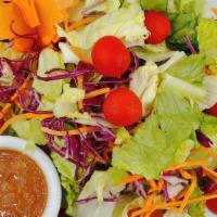 Thai Salad · Mixed greens, carrots, tomatoes ,cucumber and red onions. Served with a peanut sauce.
