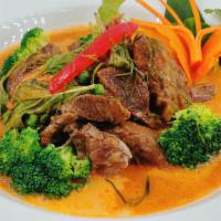 Bangkok Beef Panang Curry · Slow cooked beef in a sweet Panang curry coconut sauce bell peppers, carrots, green peas and...