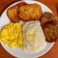 Classic Breakfast · Classic Breakfast served with creamy grits, two eggs and buttered toast. 
Choice of meat: ba...