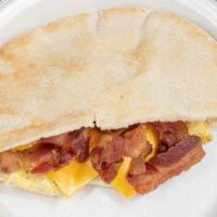 Breakfast In A Sack · Two eggs with your choice of bacon, sausage, or ham in a pita. Add cheese for an additional ...