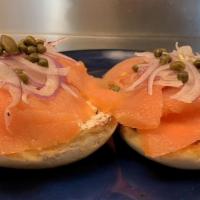 Acme Lox & Bagel · Nova lox, cream cheese, sliced tomato, onion, capers, toasted bagel.