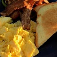 Breakfast Scramble · Scrambled eggs, bacon, challah, Lucky's hash.