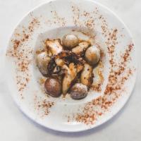Pulpo A La Gallega · Tender seared octopus, potatoes, sweet pimenton, olive oil.