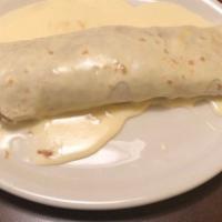 Burrito Special · One beef burrito with sauce topped with shredded cheese lettuce, sour cream and tomatoes.