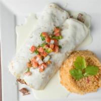 Burrito De La Roqueta · Two burritos filled with delicious chunks of pork tenderloin simmered in beer and topped wit...