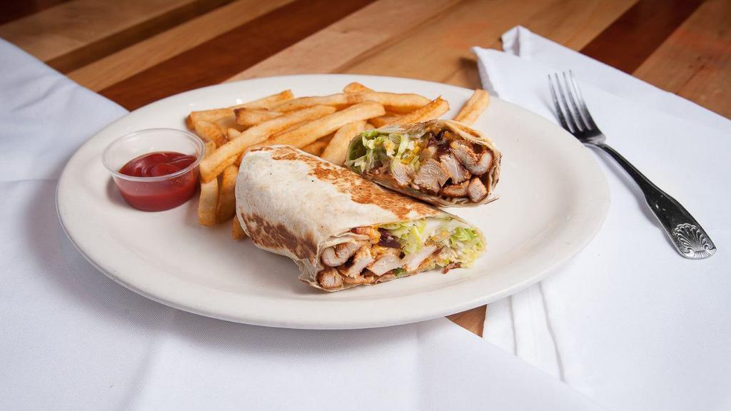 Texano Chicken Wrap · Grilled chicken, lettuce, bacon, avocado, monterrey jack cheese and chipotle mayo sauce. All wrapped in Flour or wheat tortilla. Served with your choice of beans or French fries.