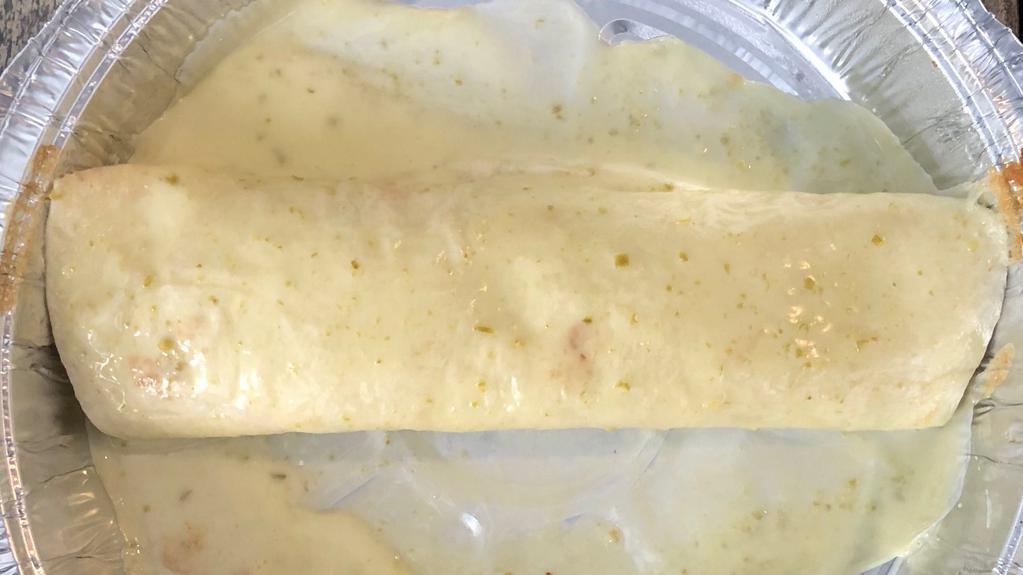 Burrito Con Queso · Your choice of ground beef or shredded chicken, smothered in cheese dip. Served with choice of guacamole salad, rice or refried beans.