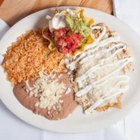 Chilaquiles Mexicanos · Deep fried corn tortilla casserole with slow cooked shredded chicken and melted cheese. Your...