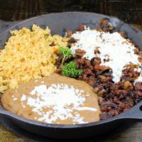 Steak Hacienda · Steak and chorizo cooked with onions, mushrooms and chihuahua cheese. Served with rice, bean...