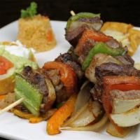 Alambres · Two steak kabobs served with a side of rice and a house salad. A must have!