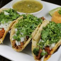 Tacos Jalisco · 3 steak and home chorizo tacos with queso Chihuahua melted on the bottom of your taco top wi...