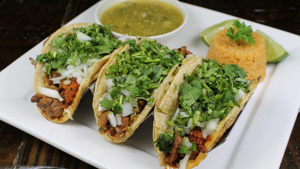 Tacos Jalisco · 3 steak and home chorizo tacos with queso Chihuahua melted on the bottom of your taco top with onions and cilantro salsa verde on the side
