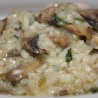 Wild Mushroom Risotto · Arborio rice, wild mushrooms, butter, Parmesan cheese, and truffle oil. Gluten free.