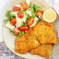 Veal Milanese · Lightly breaded and fried, arugula, tomatoes, lemon, olive oil.