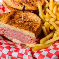 Reuben Specialty Sandwich · Corned beef, melted Swiss, sauerkraut, and Russian dressing on grilled rye bread. Served wit...