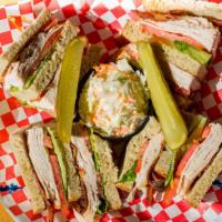 Turkey Club Specialty Sandwich · Triple decker with fresh cut Turkey, loaded with bacon, lettuce, and tomato. Served with cho...