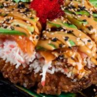 Sushi Pizza · Crispy rice patty topped with avocado, crab salad, fresh sliced tuna or salmon, topped with ...
