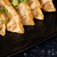 Veggies Gyozas · Available steamed or deep-fried. Dumplings made with delicate dough and filled with a mixtur...