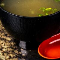 Miso Soup · Traditional Japanese soup, miso stock, scallions, dry seaweed, and tofu.