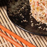 Kani Kama Crunch · Crab salad, scallions, sriracha-mayo sauce, eel sauce, tempura flakes, topped with masago.