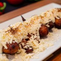 Maduros Con Crema · Sweet plantains with cream and white cheese.