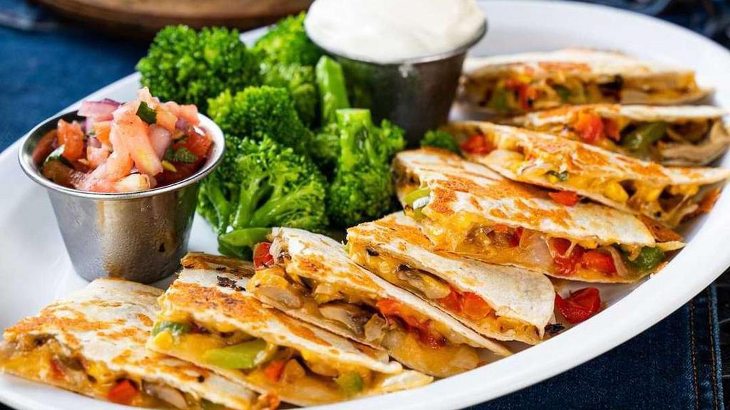 Quesadilla De Vegetales · Fresh vegetable, sauteed mushrooms, onions, peppers, mixed cheese, tomatoes, and broccoli mixed in a grilled flour tortilla.