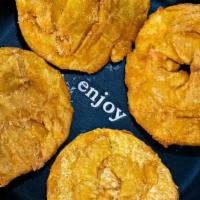 Patacones · Fried green plantains.