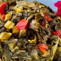 Vegan Collard Greens · Crispy collard greens slowly simmered with onions and peppers in a vegetable stock. 
**Vegan...
