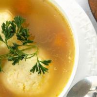 Matzo Ball Soup Pt/Qt · Our  famous chicken soup with homemade matzo ball, served with twice-baked rye bread or bage...